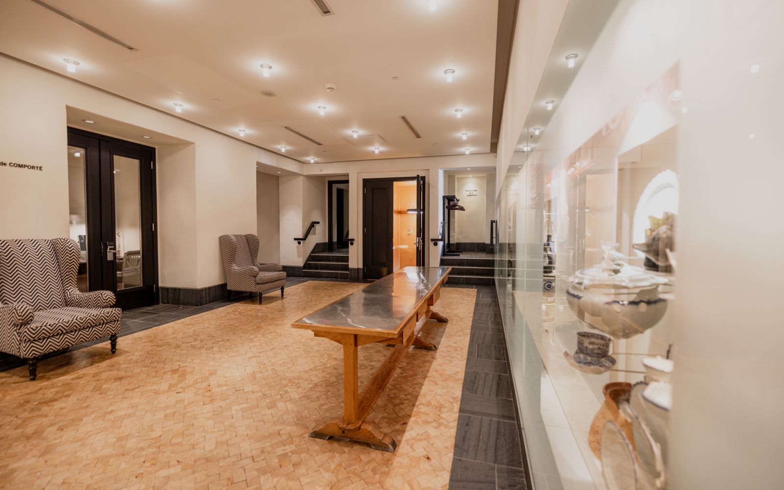 A Large Room With A Table And Chairs